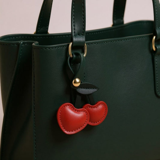 Faux Leather Cherry Heart Keychain with Black Leaf Strap and Gold Rivet Detail