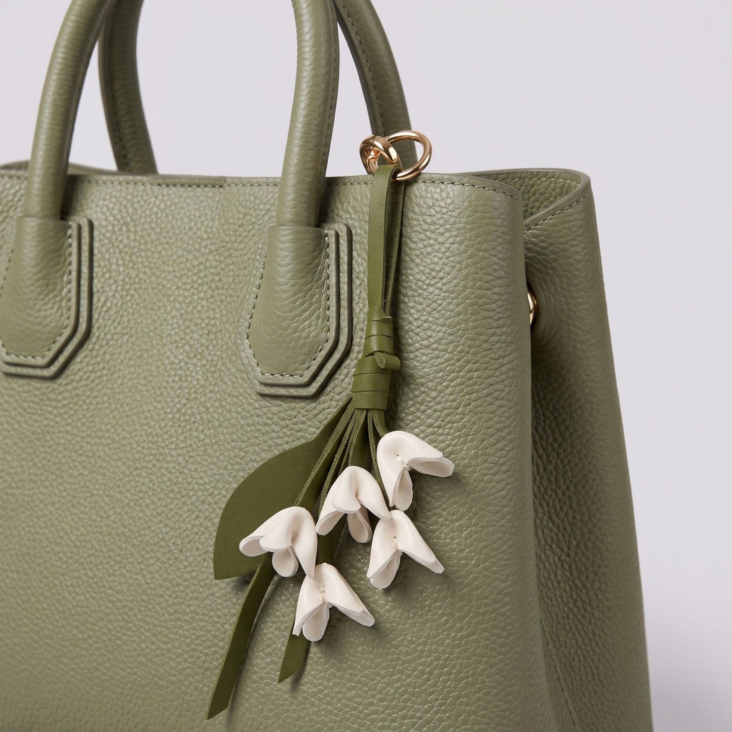 Floral Bag Charm with Tassel Strap and Gold Tone Ring