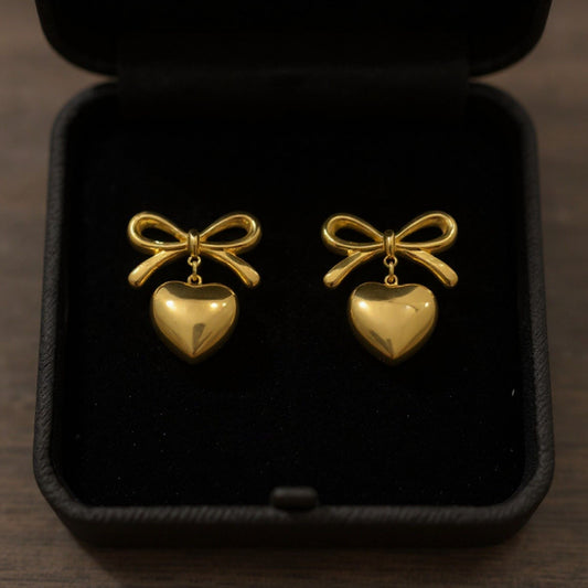 Women's Bow Stud Earrings with Metallic Heart Dangle Charm and Polished Modern Cute Design