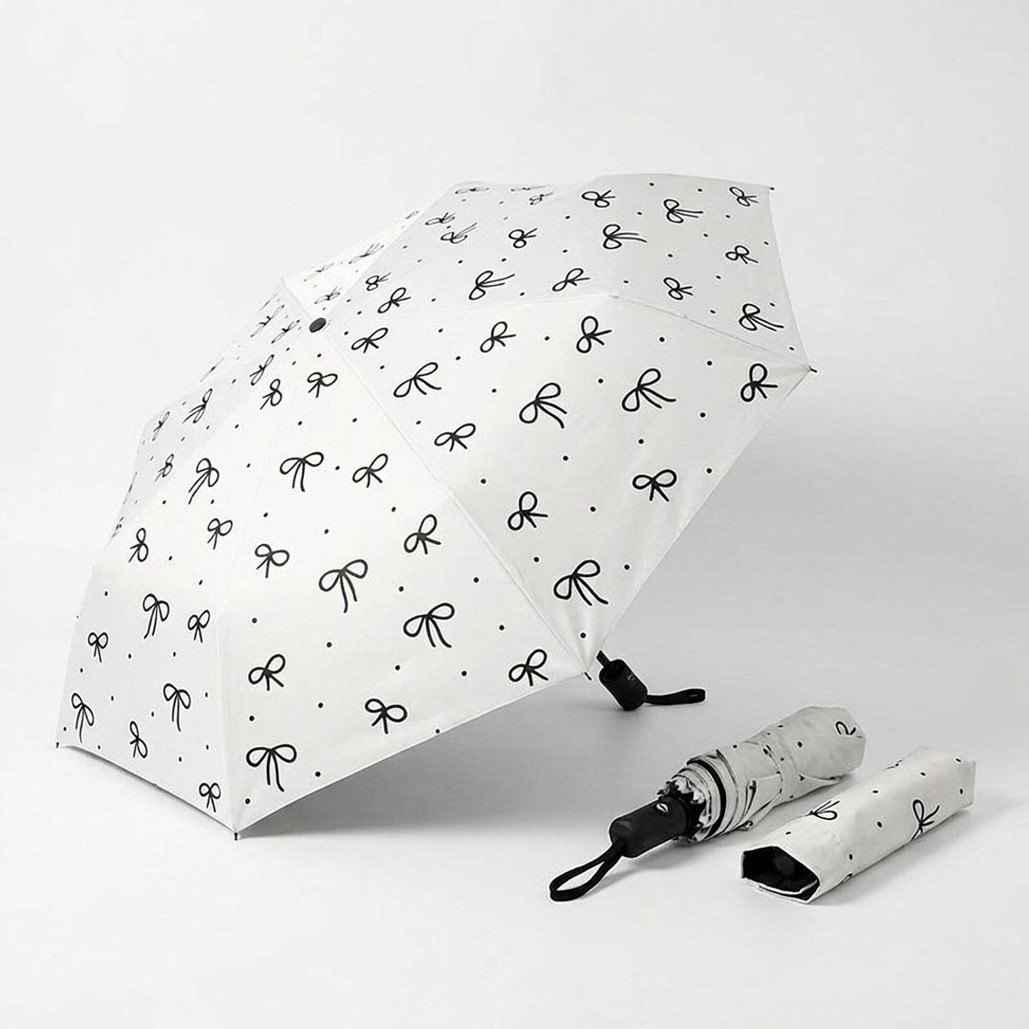 Compact Folding Umbrella with Bow Print Canopy Automatic Open Wind Resistant Frame and Strap