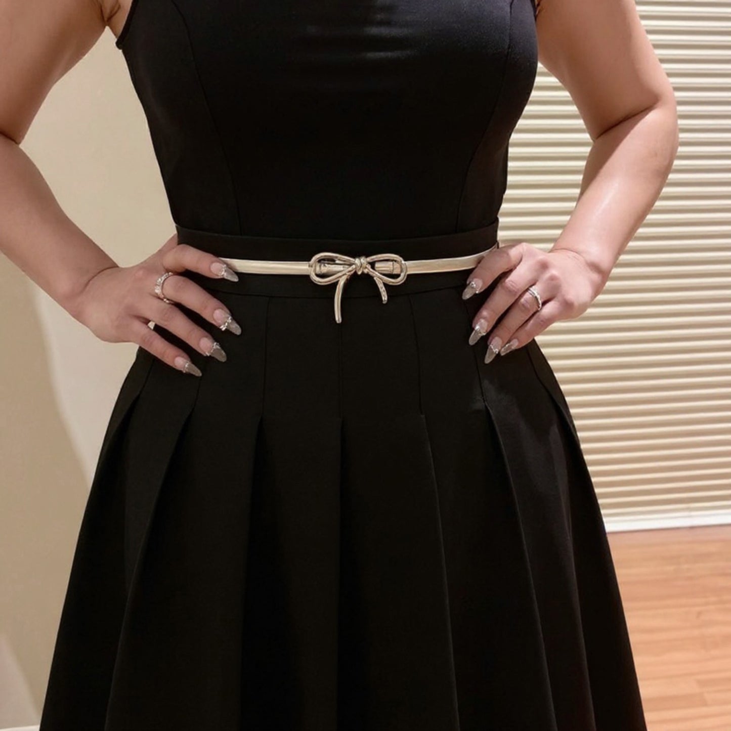 Thin Metallic Belt with Polished Bow Accent and Adjustable Fit 27.5x0.4in