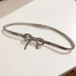 Thin Metallic Belt with Polished Bow Accent and Adjustable Fit 27.5x0.4in