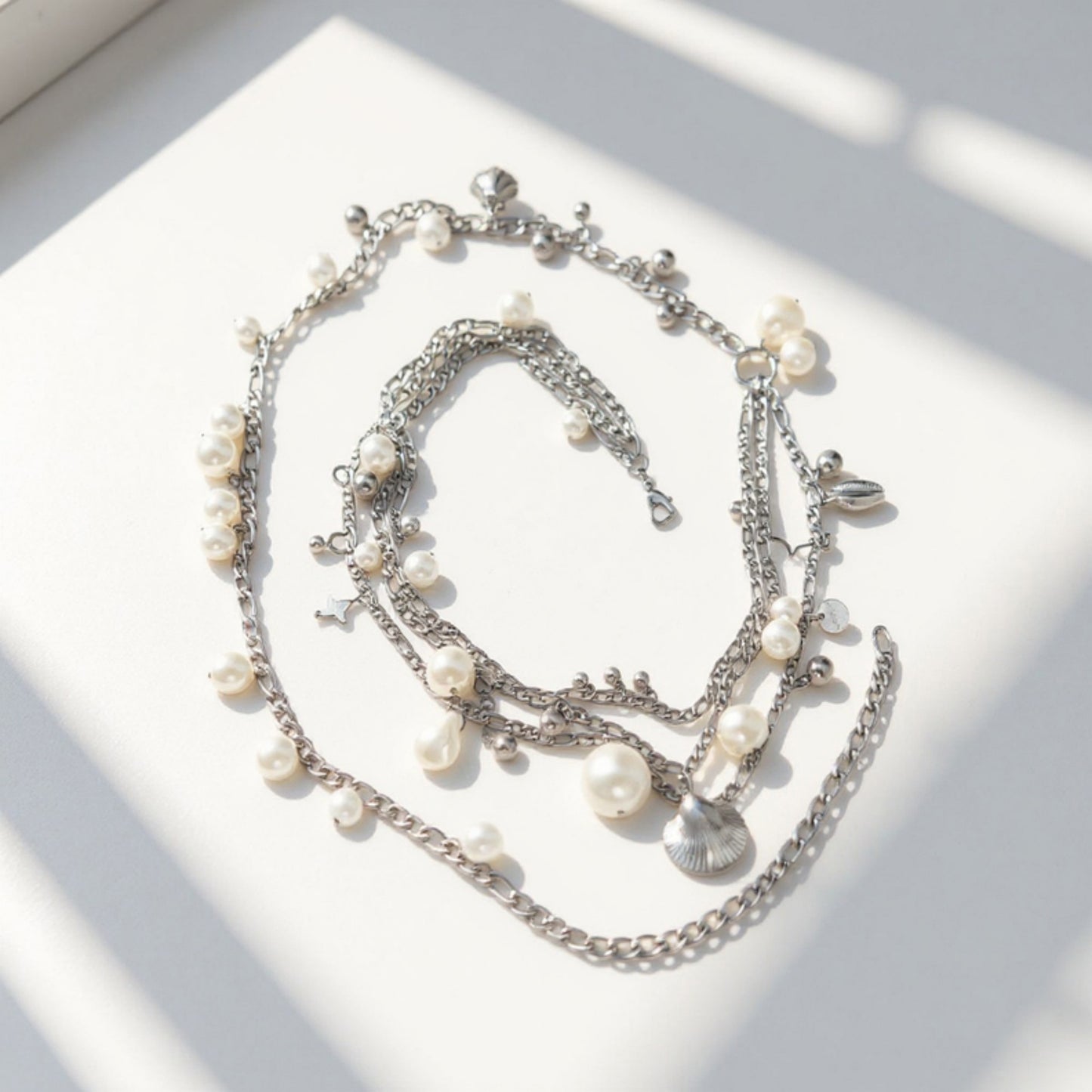 Layered Chain Belt with Pearl Charms and Metal Leaf Details