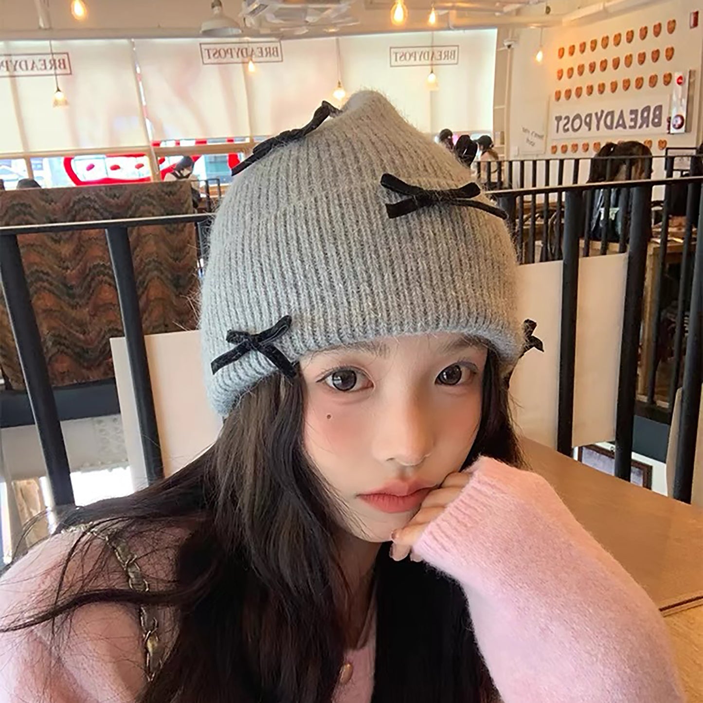 Knitted Beanie with Black Bow Accents - Cute & Stylish Winter Hat for Cold Weather