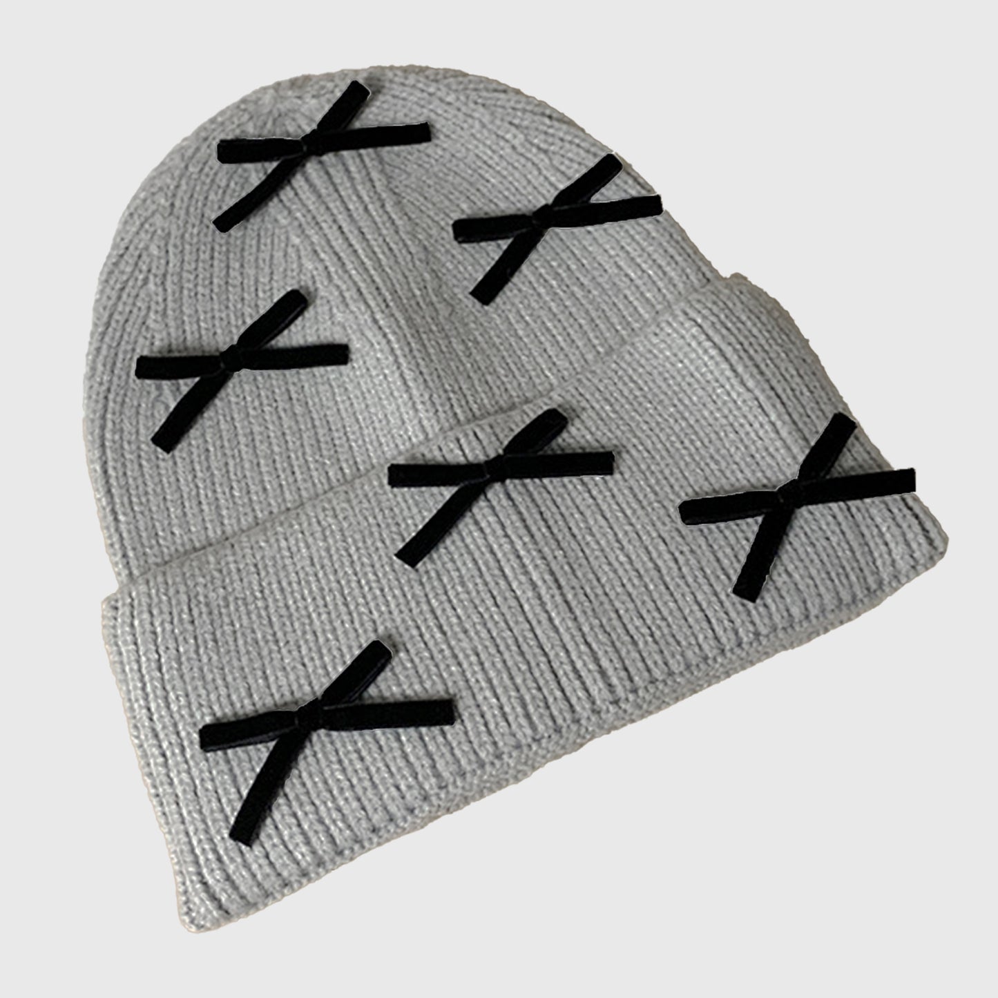 Knitted Beanie with Black Bow Accents - Cute & Stylish Winter Hat for Cold Weather