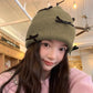 Knitted Beanie with Black Bow Accents - Cute & Stylish Winter Hat for Cold Weather