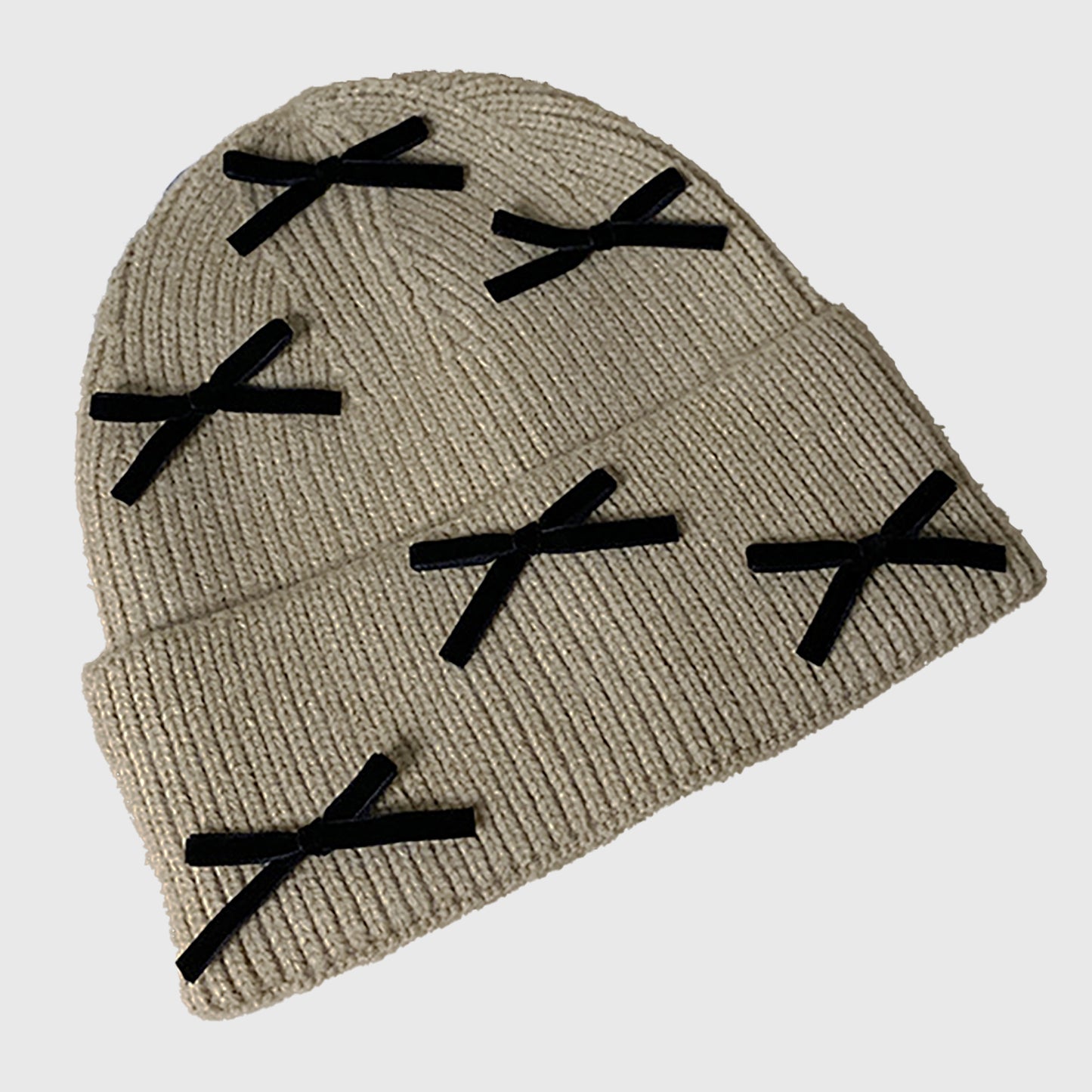 Knitted Beanie with Black Bow Accents - Cute & Stylish Winter Hat for Cold Weather