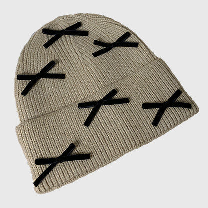 Knitted Beanie with Black Bow Accents - Cute & Stylish Winter Hat for Cold Weather
