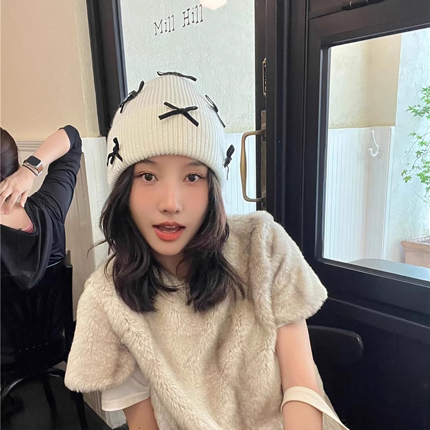 Knitted Beanie with Black Bow Accents - Cute & Stylish Winter Hat for Cold Weather