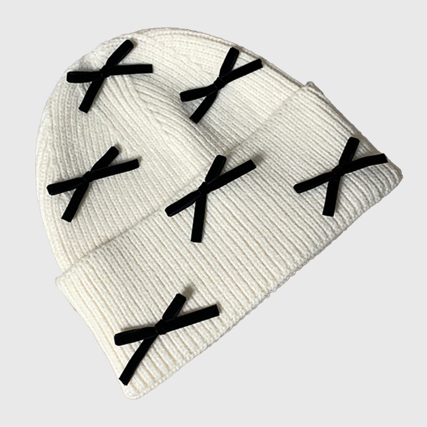 Knitted Beanie with Black Bow Accents - Cute & Stylish Winter Hat for Cold Weather