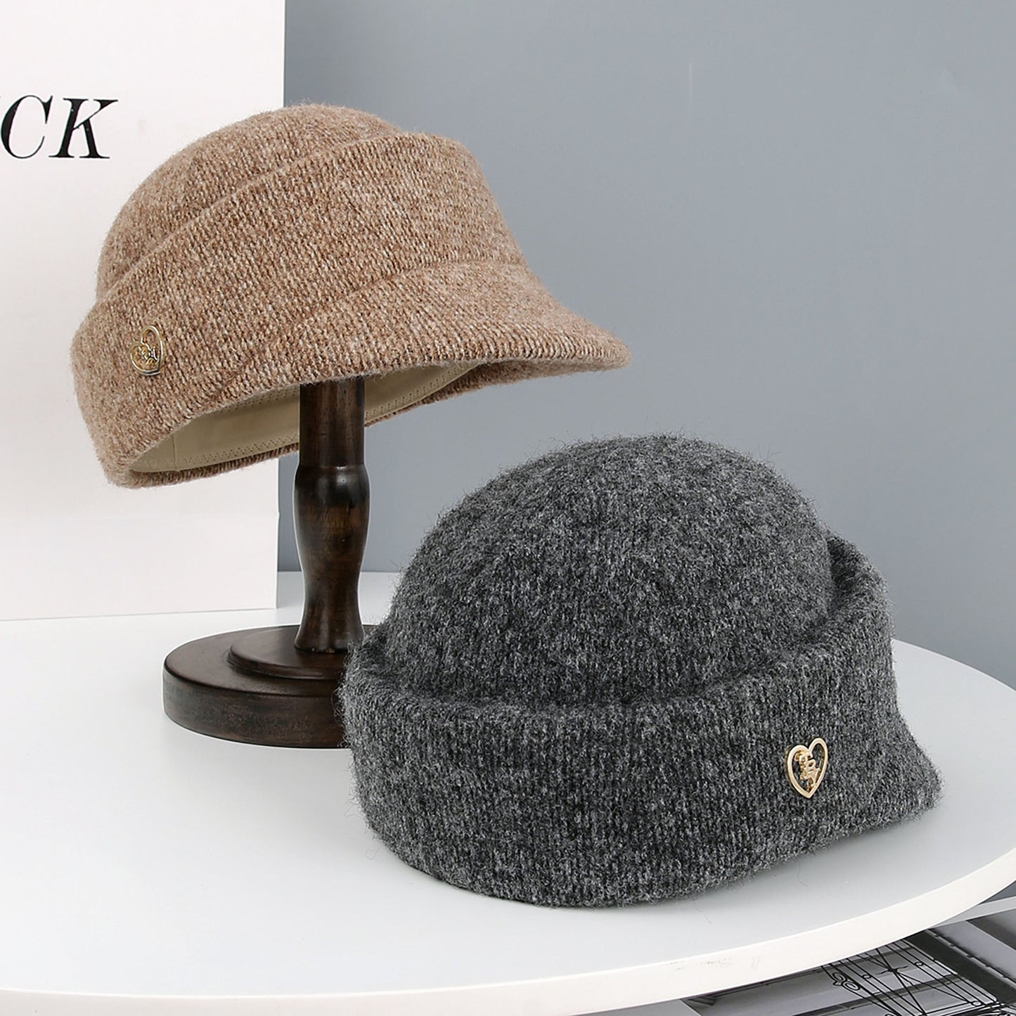 Knit Cloche Hat with Structured Brim and Decorative Metal Accent