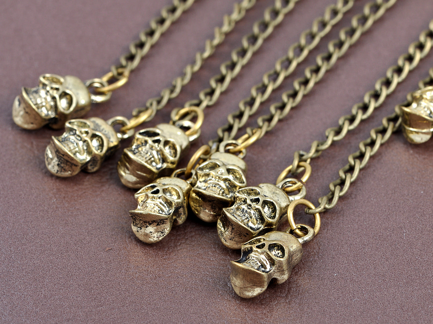 Grey Bronze Dangling Skull Chorus Line Shimmering Utter Magic Cuff Earrings