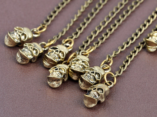 Grey Bronze Dangling Skull Chorus Line Shimmering Utter Magic Cuff Earrings