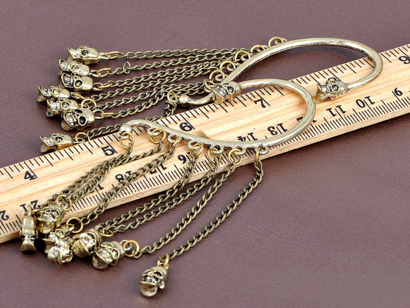 Grey Bronze Dangling Skull Chorus Line Shimmering Utter Magic Cuff Earrings