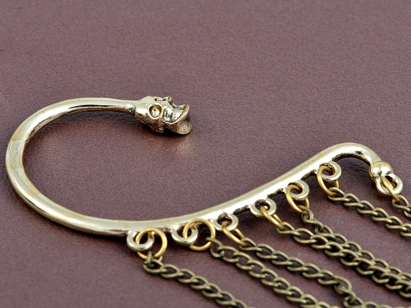 Grey Bronze Dangling Skull Chorus Line Shimmering Utter Magic Cuff Earrings