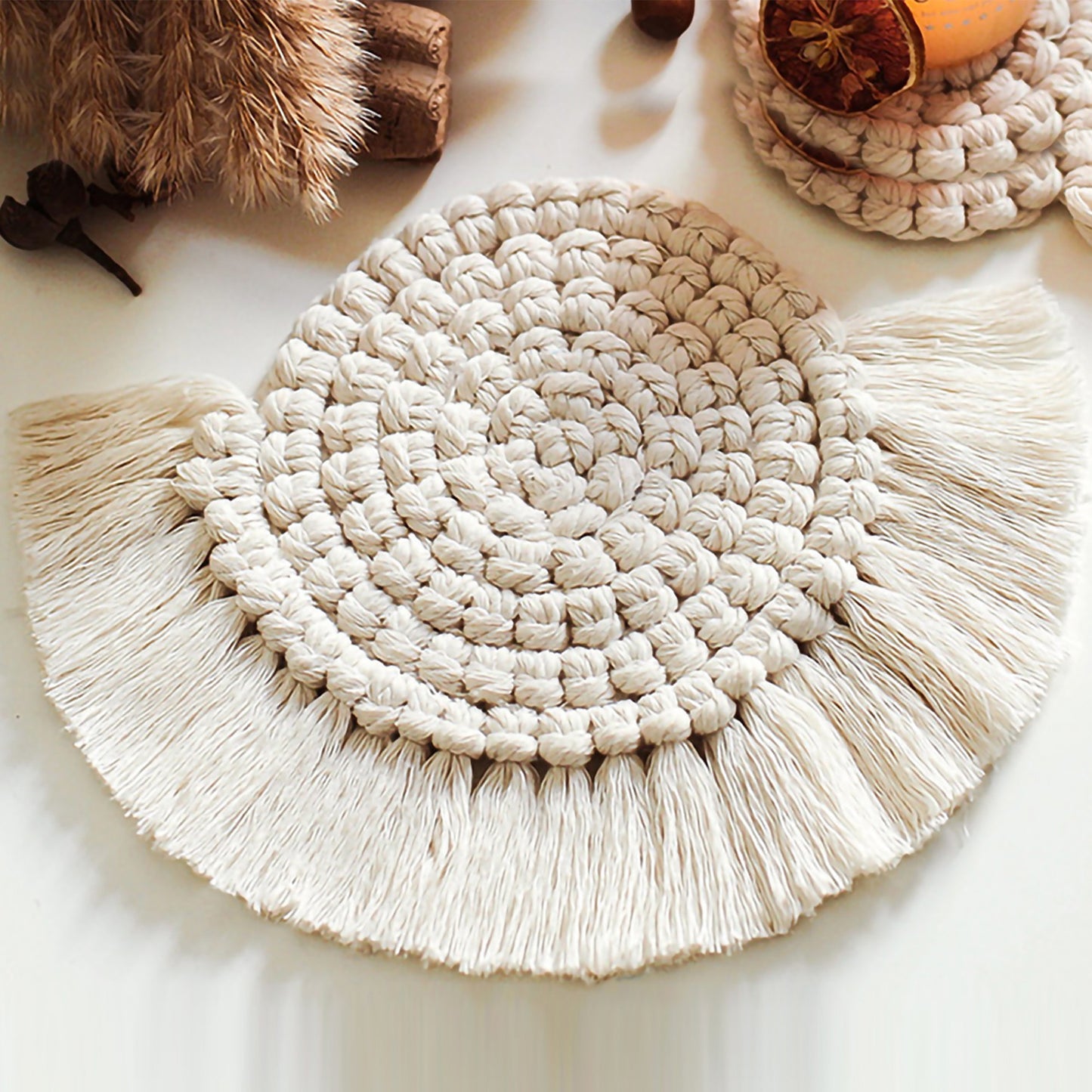 Woven Fiber Coaster with Fringe Detail for Tabletop Protection and Decorative Candle Display