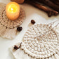Woven Fiber Coaster with Fringe Detail for Tabletop Protection and Decorative Candle Display