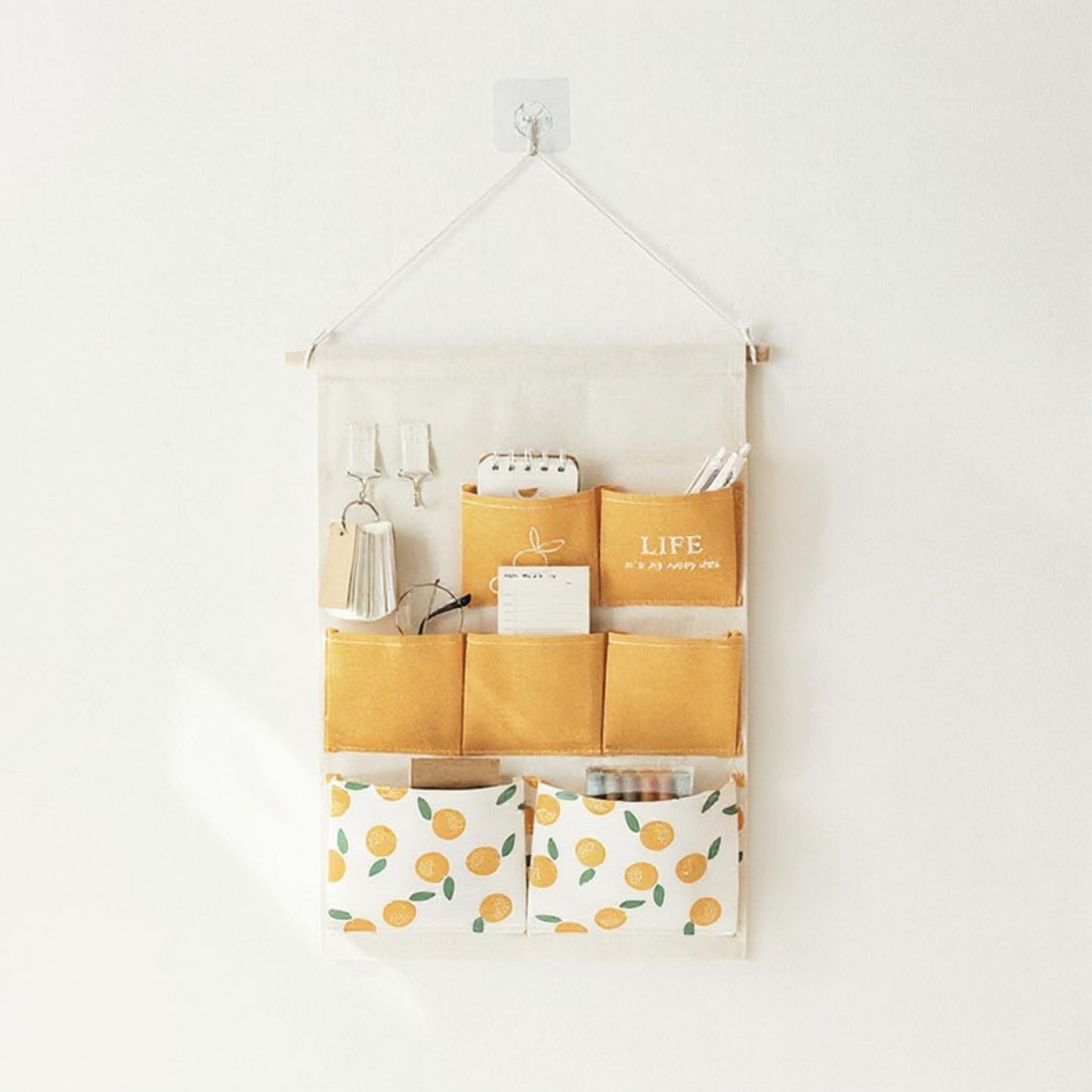 Hanging Wall Storage Organizer with Multiple Fabric Pockets and Orange Fruit Print Design