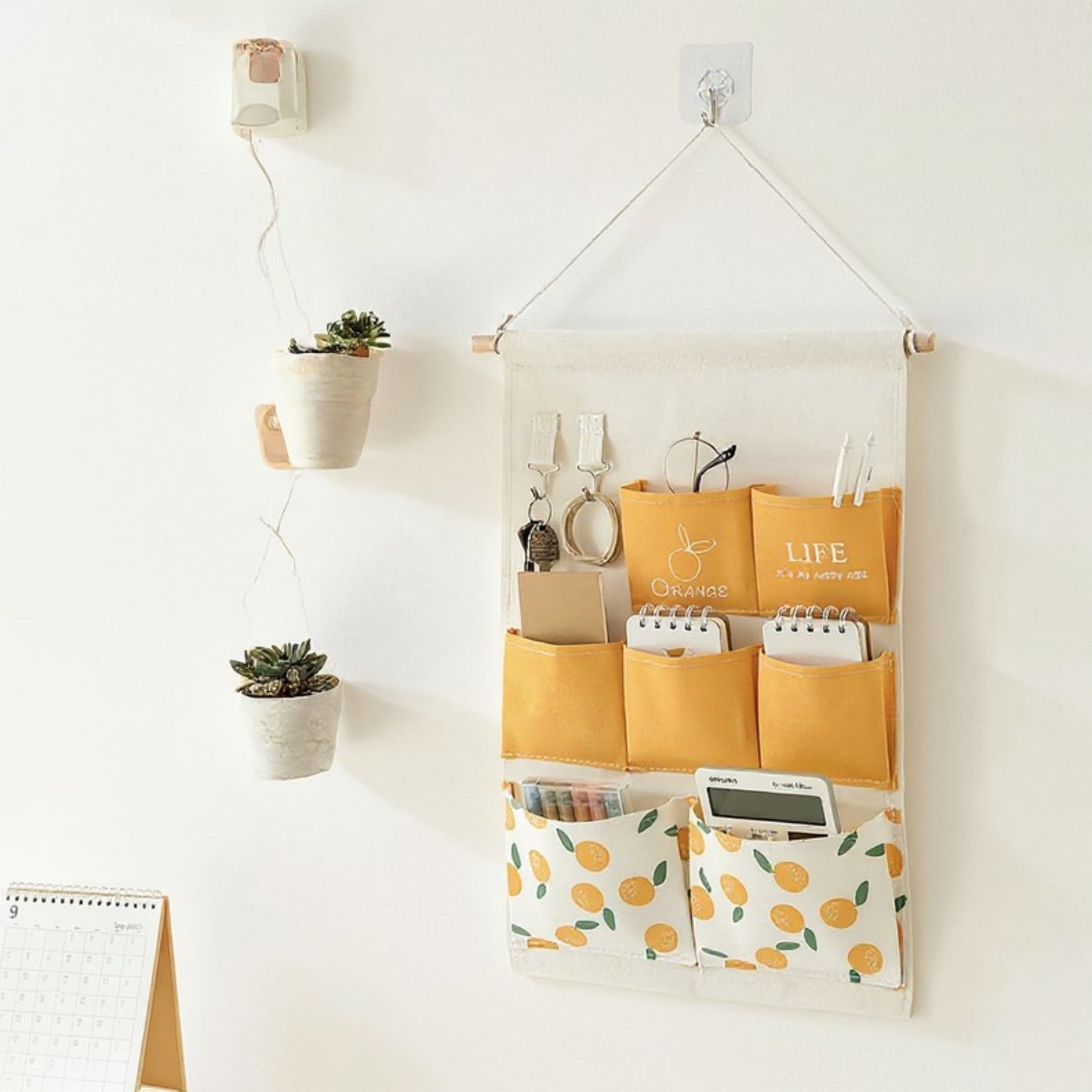 Hanging Wall Storage Organizer with Multiple Fabric Pockets and Orange Fruit Print Design