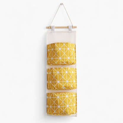 Hanging Wall Organizer with Three Fabric Pockets and Wooden Rod Design
