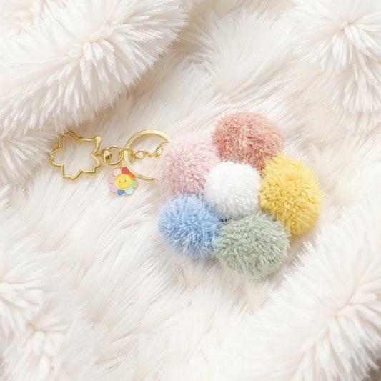 Multicolor Pom Pom Keychain with Gold Flower Charm and Smiley Accent