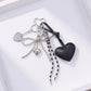 Heart Charm Keychain with Silver Chain Details and Bow Accent