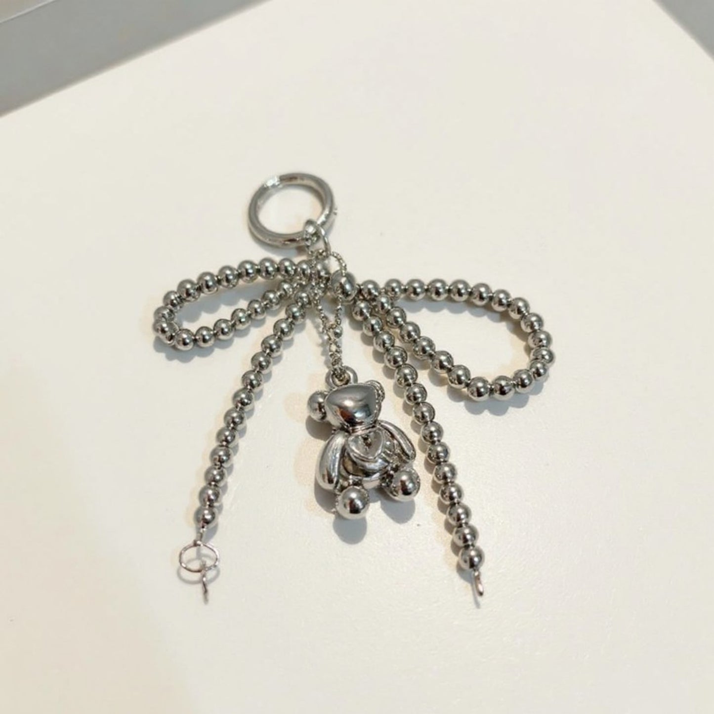 Metallic Beaded Bow Keychain with Crystal Bear Charm and Ring Accent