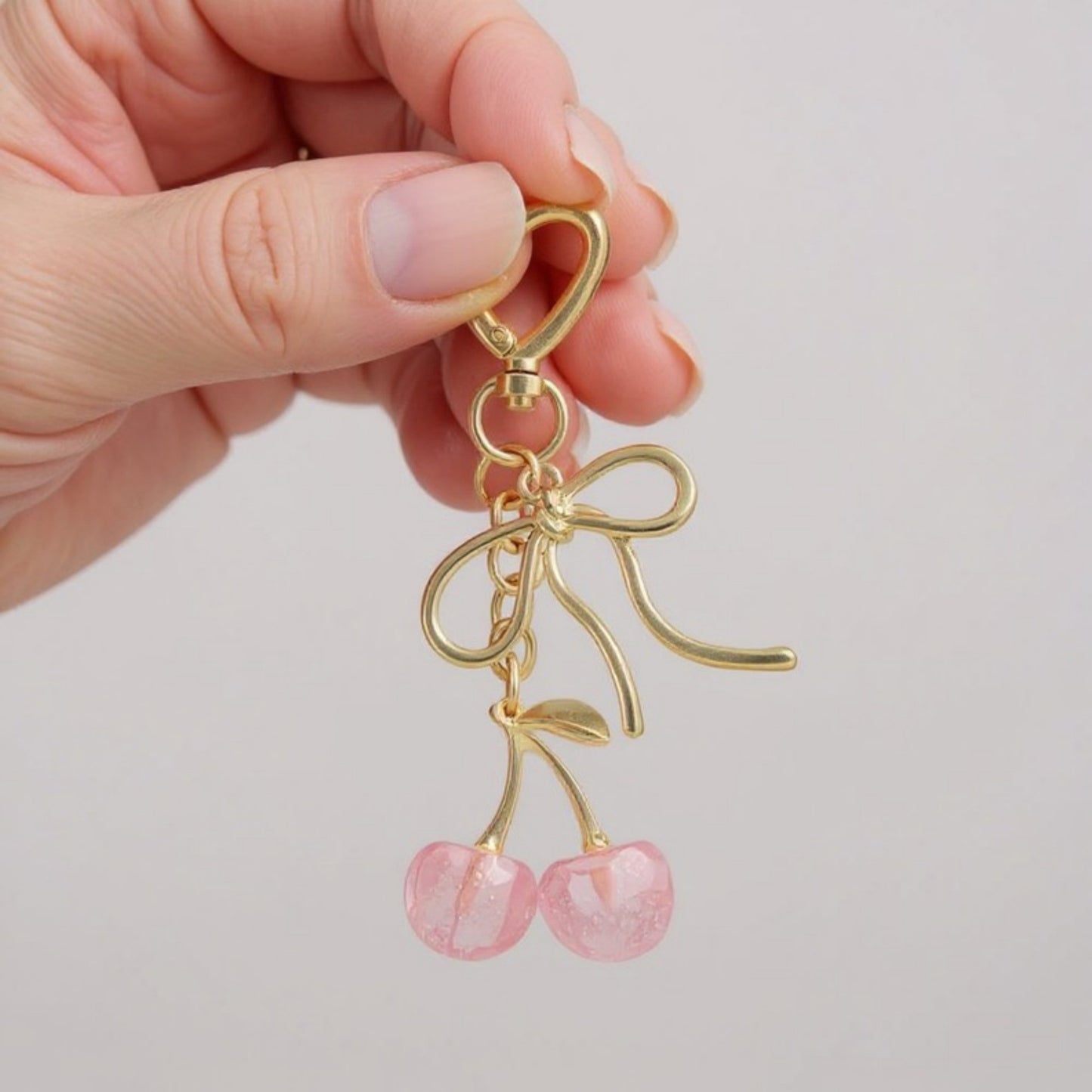 Gold Bow Keychain with Pink Cherry Charms and Heart Clasp