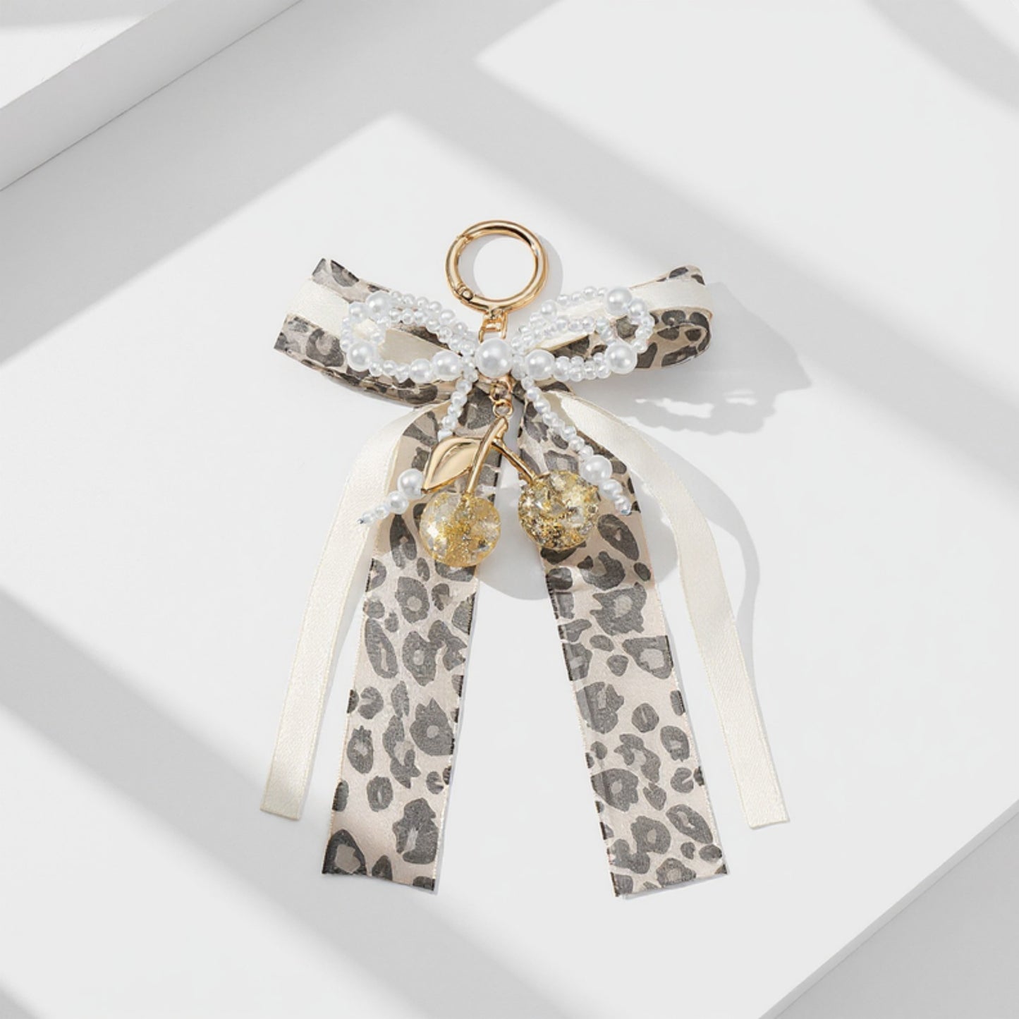 Leopard Print Ribbon Keychain with Pearl Bow and Cherry Charms