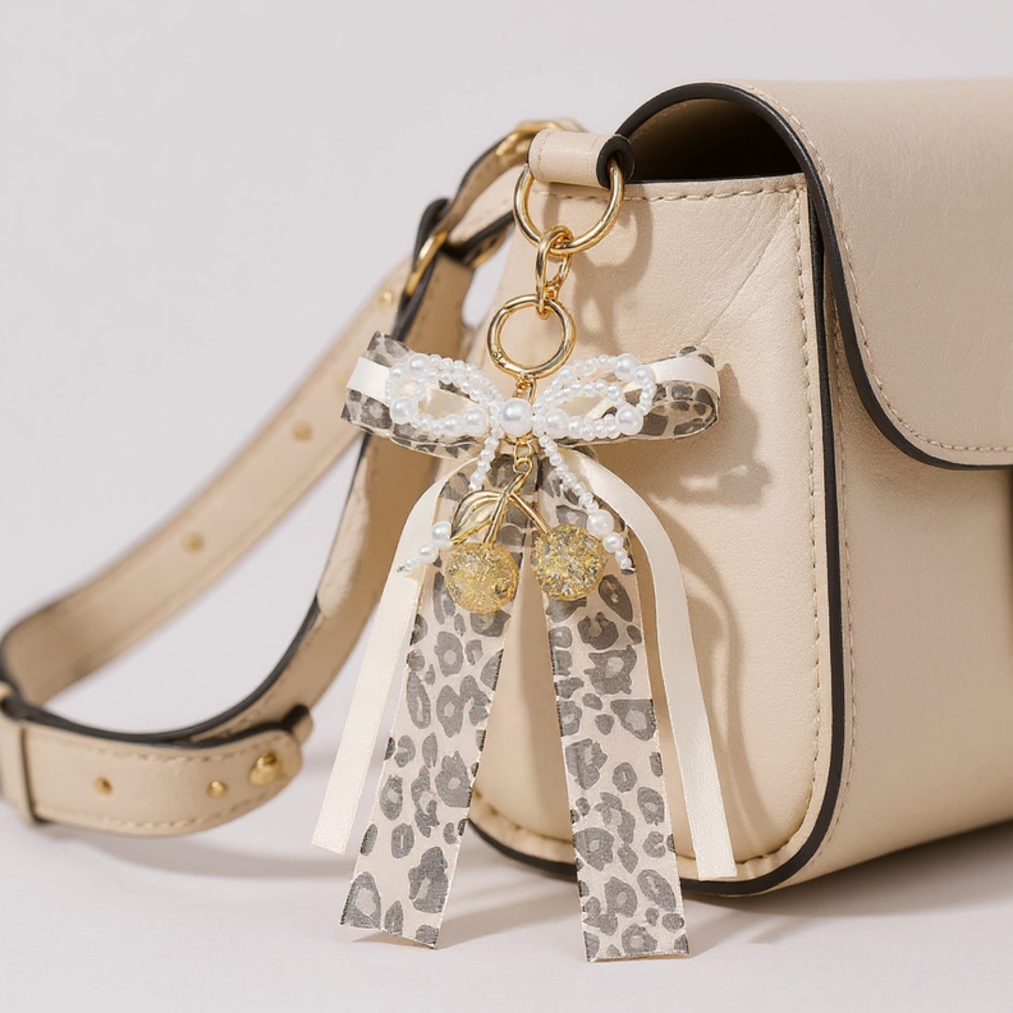 Leopard Print Ribbon Keychain with Pearl Bow and Cherry Charms