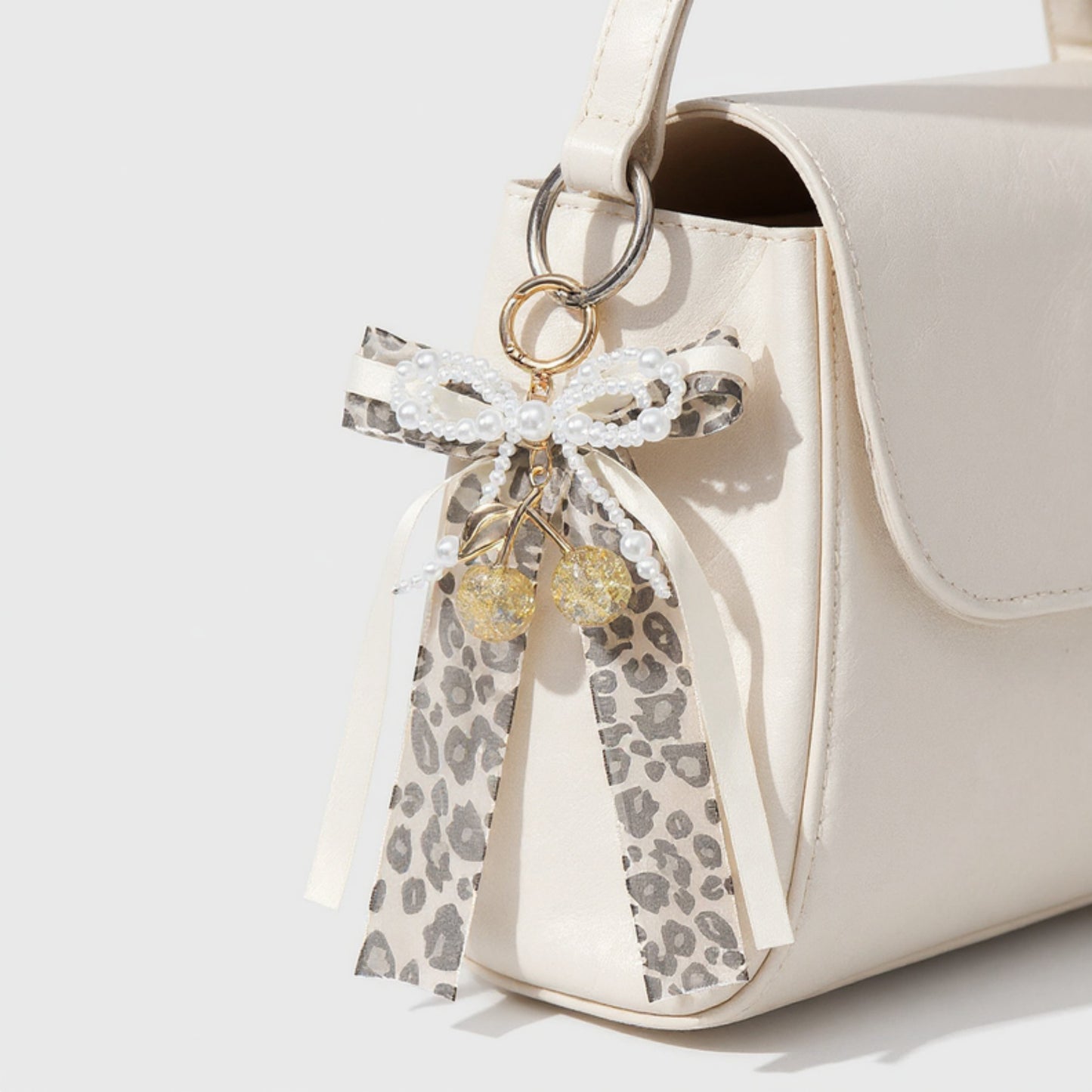 Leopard Print Ribbon Keychain with Pearl Bow and Cherry Charms