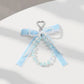 Blue Ribbon Keychain with Pearl Bow and Iridescent Beaded Star Charms
