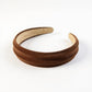 Textured Fabric Headband with Oversized Acrylic Ring Accent 6.3x4.7x1.2in