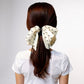 2-Piece Polka Dot Bow Hair Clips Set with Ribbon Tails and Oversized Design 7x4.7in