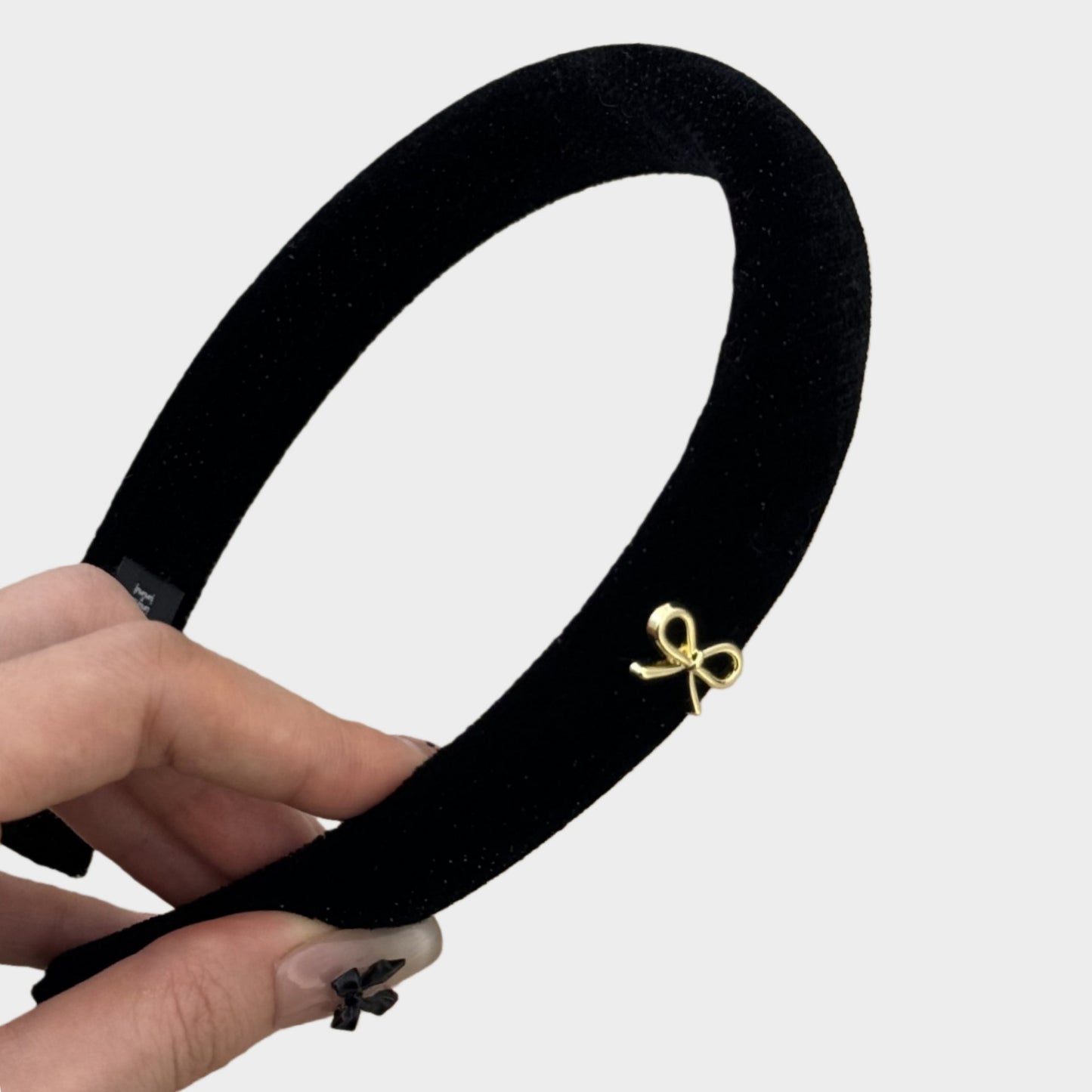 Padded Headband with Soft Velvet Texture and Delicate Bow Accent Detail