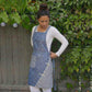 Floral Pattern Kitchen Apron with Adjustable Shoulder Straps Front Pocket and Decorative Trim Detail
