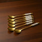 Decorative Teaspoon Set with Gold Tone Finish and Patterned Handle Design