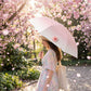 Gradient-Colored Umbrella with Floral Accent and Curved Handle