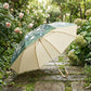 Floral Print Folding Umbrella with Gold Tone Frame Curved Handle and Matching Sleeve