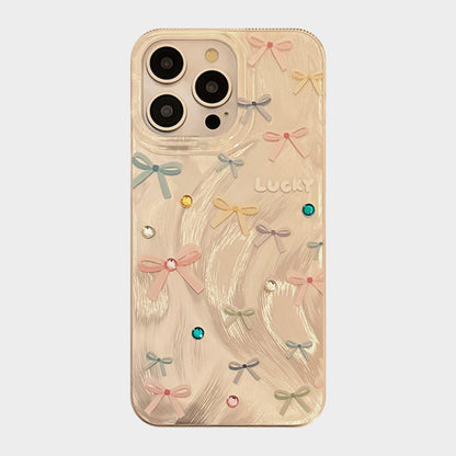 Bow Accent Phone Case with Textured Wave Finish and Decorative Crystal Details