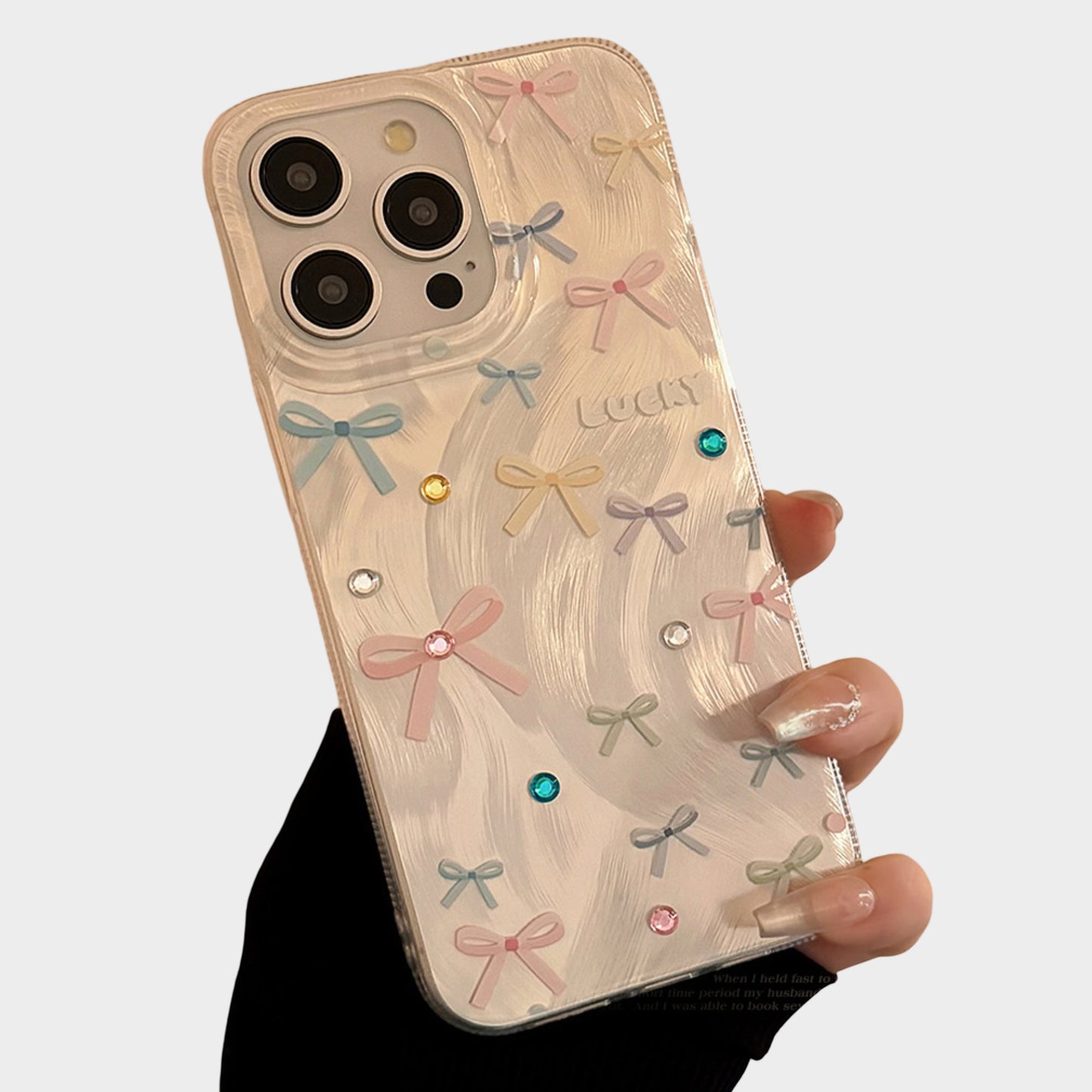 Bow Accent Phone Case with Textured Wave Finish and Decorative Crystal Details