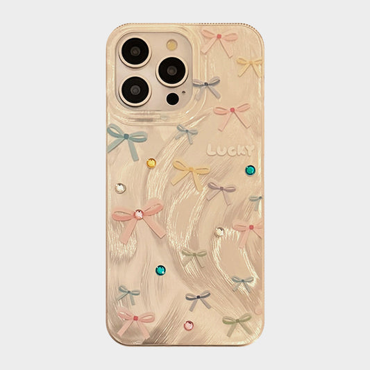 Bow Accent Phone Case with Textured Wave Finish and Decorative Crystal Details