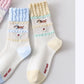 2-Pair Ruffle Cuff Crew Socks with Soft Knit Fabric Playful Character Pattern and Stretch Fit