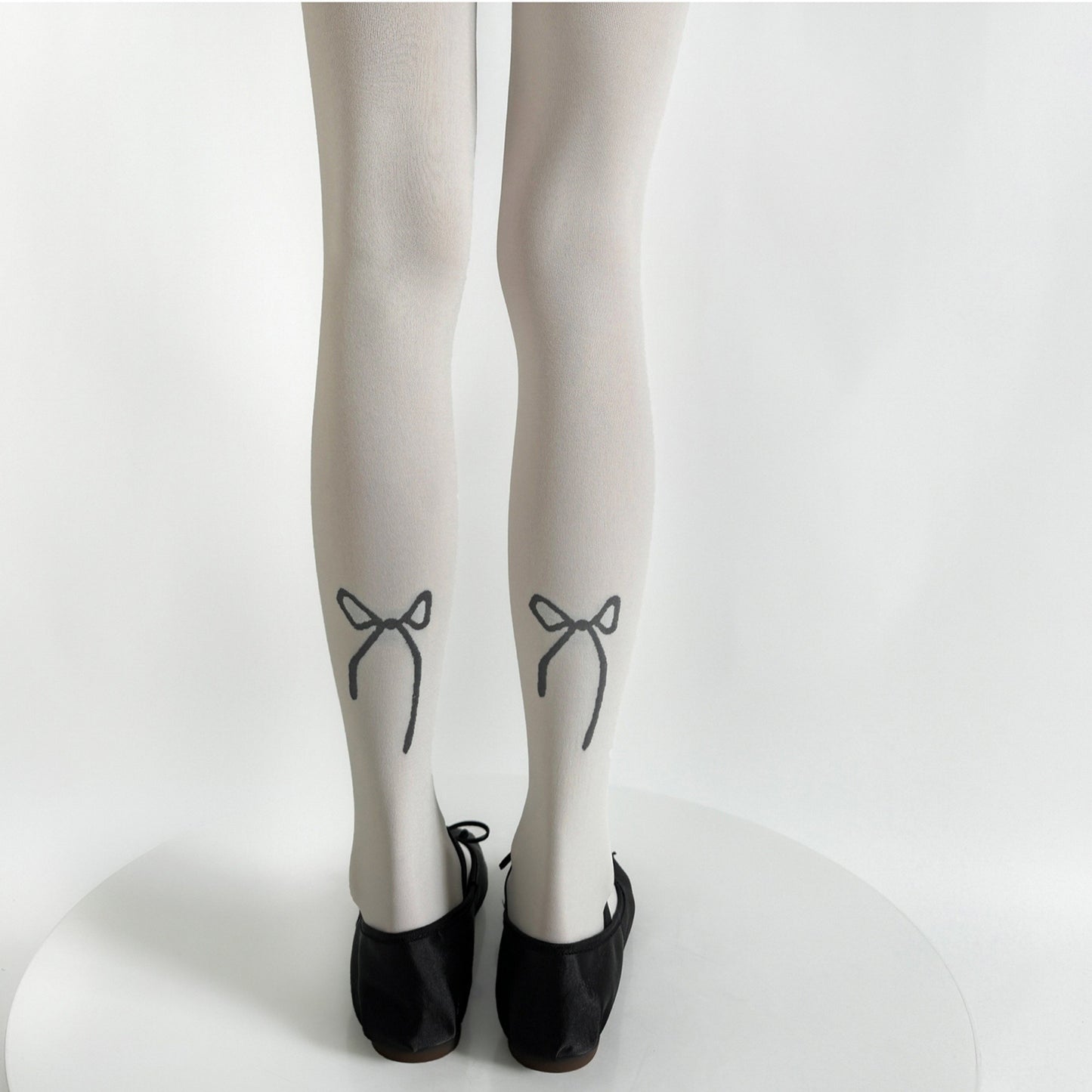 Solid Knit Tights with Embroidered Bow Detail