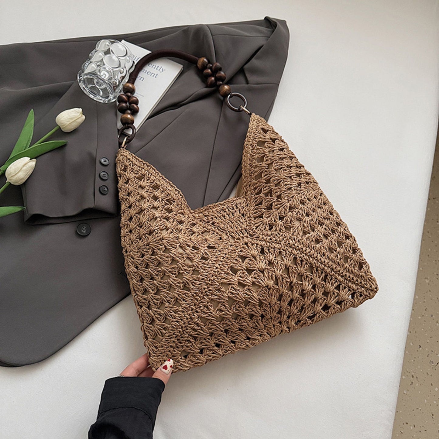 Woven Straw Hobo Bag with Wooden Handle Bead Accents and Spacious Interior