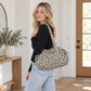 Leopard Print Barrel Shoulder Bag with Zip Closure and Interior Pockets