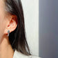 Snake-Shaped Hoop Earrings with Green Gem Eyes