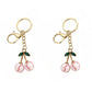 2 Pack Sports Ball Cherry Keychains with Gold Tone Clip and Leaf Charm