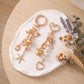 Gold-Tone Ocean & Heart Multi-Charm Bag Charm Key Chain Set 2 Pair