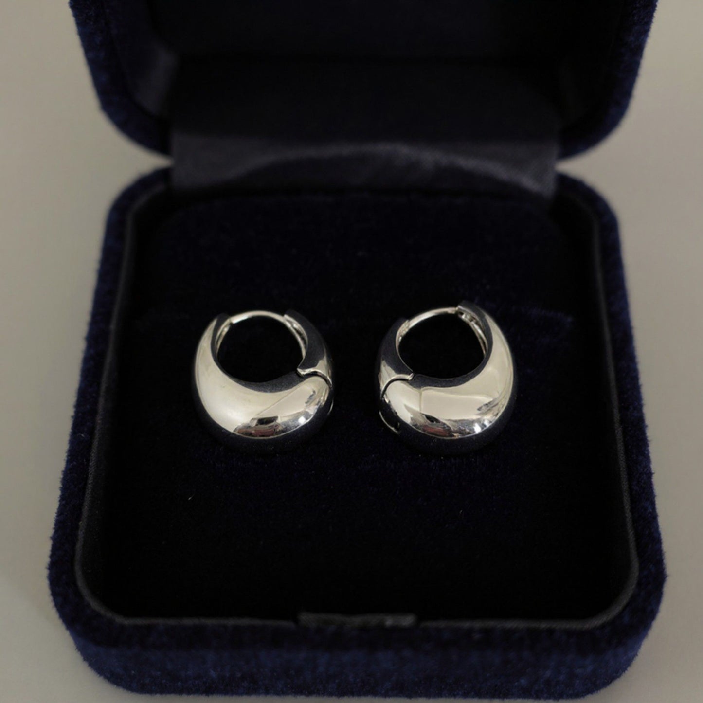 Women's Thick Hoop Earrings with Rounded Modern Design